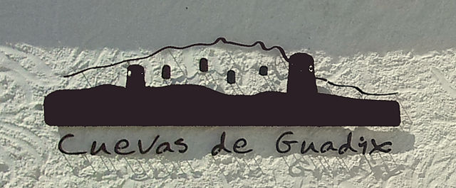 Cuevas de Guadix ~ die Stadt der Höhlenbewohner (Logo eines Übersetzungsbüros)